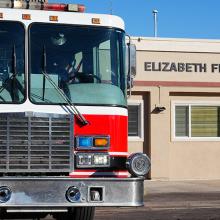 A fire truck parked in front of the Elizabeth Fire Protection District station.