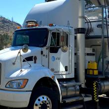 Integrating broadband into tribal public safety planning, preparedness A FirstNet Satellite Cell on Light Truck parked outside and surrounded by trees