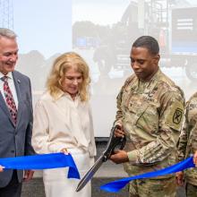 Fort Benning Garrison Commander Colonel Jerel Evans, along with representatives from the U.S. Army, FirstNet Authority, and AT&T, cuts a blue ribbon.