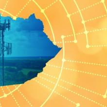 The silhouette of the State of Kentucky revealing a cell tower inside; radiating connectivity illustration