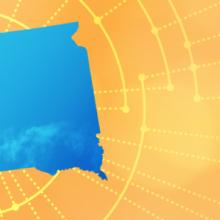 The silhouette of the State of South Dakota revealing a cell tower inside; radiating connectivity illustration The silhouette of the State of South Dakota revealing a cell tower inside; radiating connectivity illustration