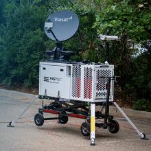 The Hamilton County logo fades into a FirstNet compact rapid deployable.  
