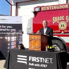 John Joyce talking outside in front of a fire truck during a press event in Huntingdon County, PA.