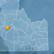 The state of Idaho, with outlined county borders and star locating Garden Valley, Idaho; a cell tower.