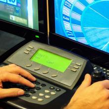 Security officer monitoring casino floor through security cameras