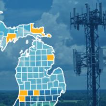 The state of Michigan, with outlined county borders; a cell tower The state of Michigan, with outlined county borders; a cell tower