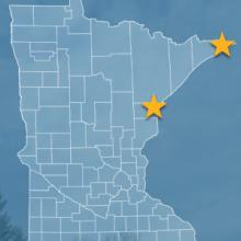 The state of Minnesota, with outlined county borders and two stars locating Cloquet and Hovland, Minnesota; a cell tower.