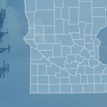 The state of Minnesota, with outlined county borders and a star locating Lewiston, Minnesota; a cell tower.