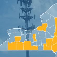 The state of New York, with outlined county borders; a cell tower.