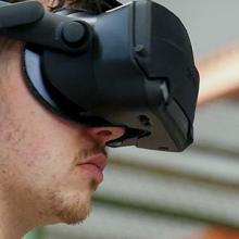 Man wearing a virtual reality headset in the Public Safety Immersive Test Center Man wearing a virtual reality headset in the Public Safety Immersive Test Center