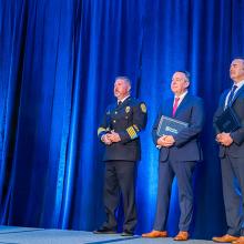 2024 Patriot Award winners 2024 Patriot Award winners stand with their certificates behind Joe Wassel