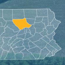 The state of Pennsylvania, with outlined county borders; a cell tower