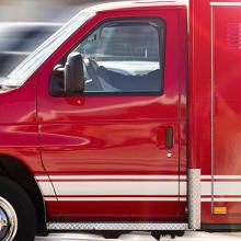 FirstNet gives EMS best-in-class communications for worst-case scenarios Red ambulance in motion with blurred road in background.