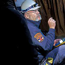 Virginia Communications Cache personnel testing communications inside a cavern