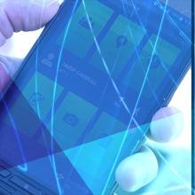 An emergency manager points towards a screen displaying a map, an officer holds a smartphone displaying an app, an EMS technician interacts with a display screen An emergency manager points towards a screen displaying a map, an officer holds a smartphone displaying an app, an EMS technician interacts with a display screen