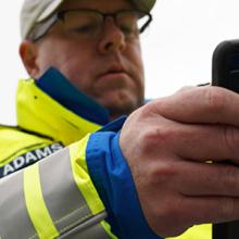 First responder holds smartphone