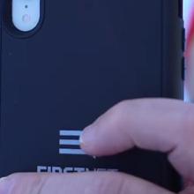 A responder in cold weather gear holds up a FirstNet smartphone A responder in cold weather gear holds up a FirstNet smartphone