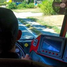 View of a town street from the windshield of a fire apparatus as a firefighter from the Hyannis Fire Department drives