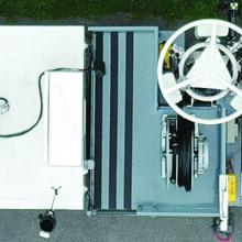 An aerial view of a Satellite Cell on Light Truck (SatCOLT) sitting in a parking lot.