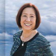 Former state, federal tech executive Teri Takai receives distinguished award for leadership in public safety communications A cell tower against the backdrop of clouds with a headshot of a woman, Teri Takai.