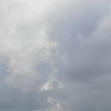 Cell tower A cell tower in front of a cloudy sky