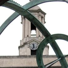 The Old Main Bell Tower sits behind the Old Main Armillary Sphere on the Pennsylvania State University campus. The Old Main Bell Tower sits behind the Old Main Armillary Sphere on the Pennsylvania State University campus.