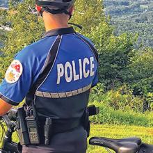 Signal Mountain officer on a bike looking at mountain