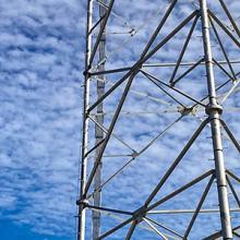 Cell tower with sky in background