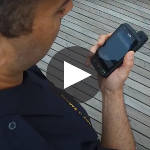 Atlantic City Police Department officer using a smart phone