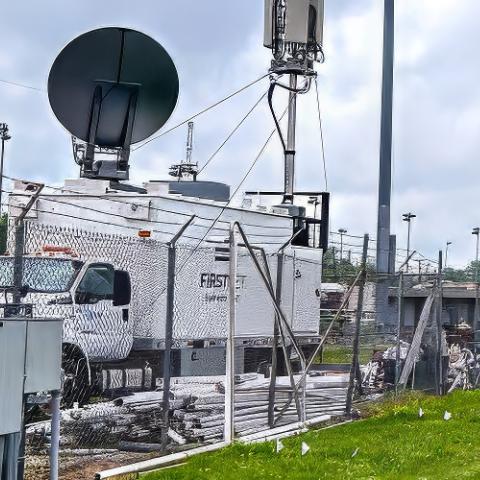 A FirstNet SatCOLT near the fence around the infield of Churchill Downs for the Kentucky Derby