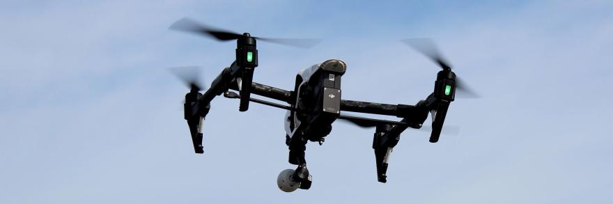 A DJI Inspire 1 drone flies in the air. 