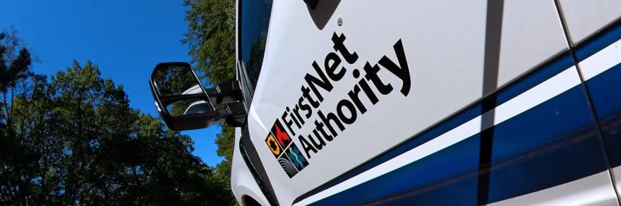 FirstNet Authority logo on a truck driving down the road