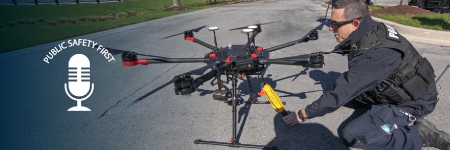 Police officer prepares drone on street; Public Safety First podcast logo; “Eyes in the Sky: Drones and FirstNet”