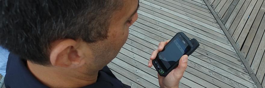 A Baltimore Police Department helicopter flies on a cloudless day.