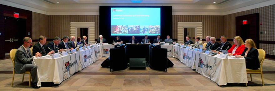 FirstNet Authority Board members sit at a table during a quarterly meeting