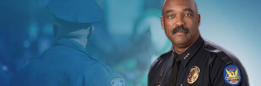 A New York police officer from behind, Harry Markley wearing his police uniform