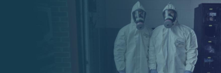 Two EMS workers wearing hazmat suits