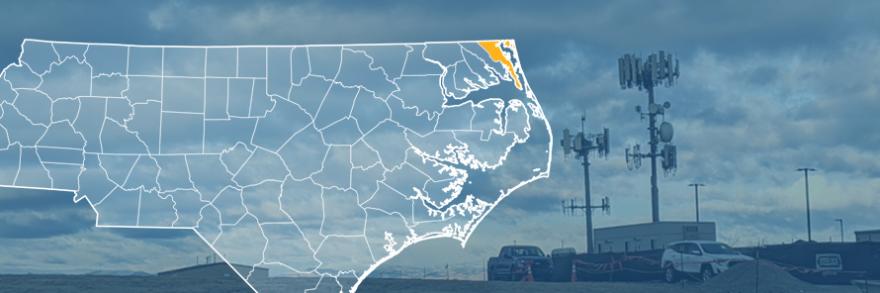 The state of North Carolina, with outlined county borders; a cell tower.