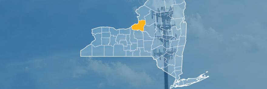 The state of New York, with outlined county borders; a cell tower.