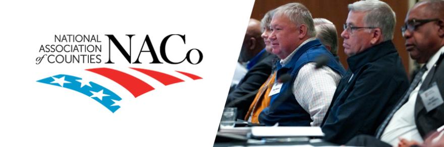 National Association of Counties logo; Public Safety Advisory Committee members seated at a table