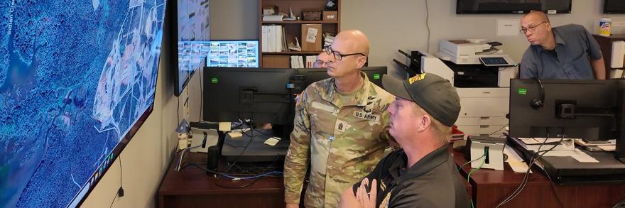 Staff at the Redstone Arsenal look at maps simulating a chemical plume response 