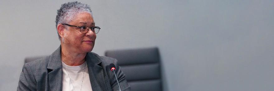 Renee Gordon in front of a microphone at at FirstNet Authority Board meeting 