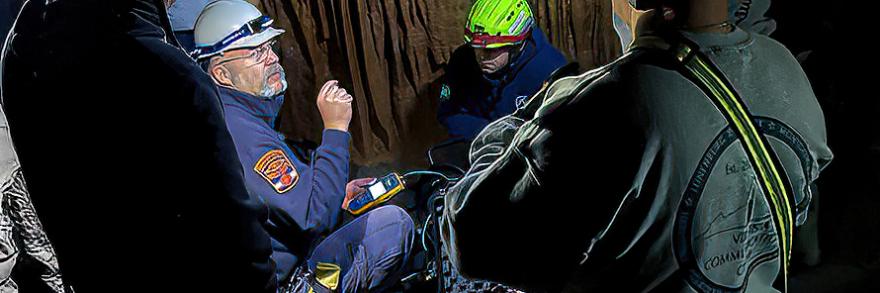 Virginia Communications Cache personnel testing communications inside a cavern