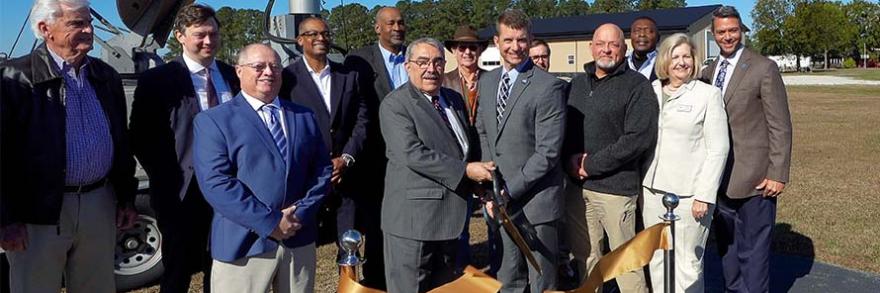FirstNet Authority staff, Congressman G.K. Butterfield (NC-1), and local leaders cut a ribbon near new FirstNet site in Wayne County North Carolina