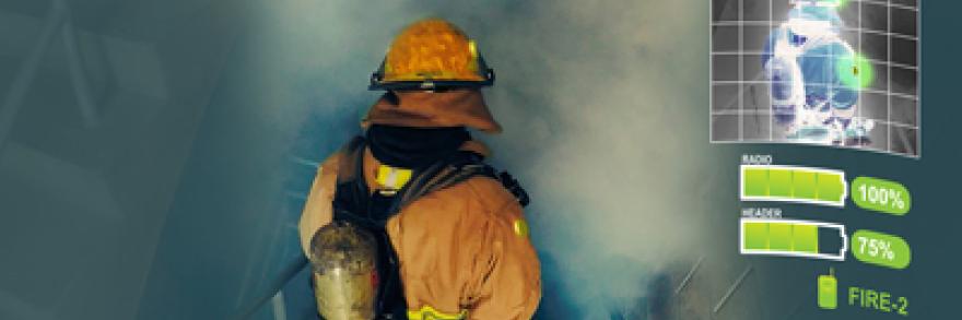 A firefighter in safety gear with a tank on his back descends stairs into a smoke filled area. 