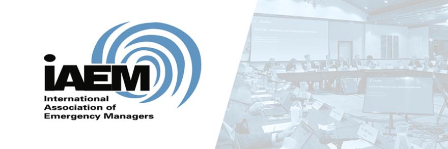 International Association of Emergency Managers (IAEM) logo and image of IAEM representatives making a presentation at a FirstNet Authority Board Meeting.