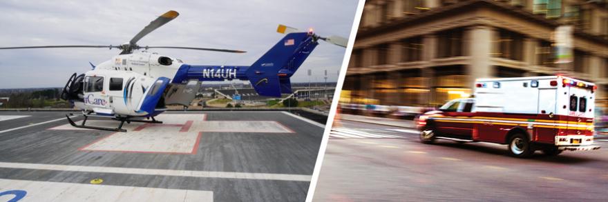 A University of Mississippi Medical Center helicopter on the roof of a medical facility and an ambulance driving on a city street.