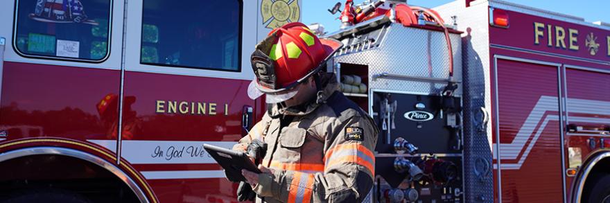 A Wayne County firefighter uses a tablet