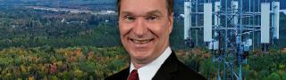 Joe Wassel headshot, FirstNet cell tower