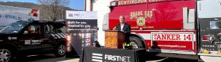 John Joyce talking outside in front of a fire truck during a press event in Huntingdon County, PA.